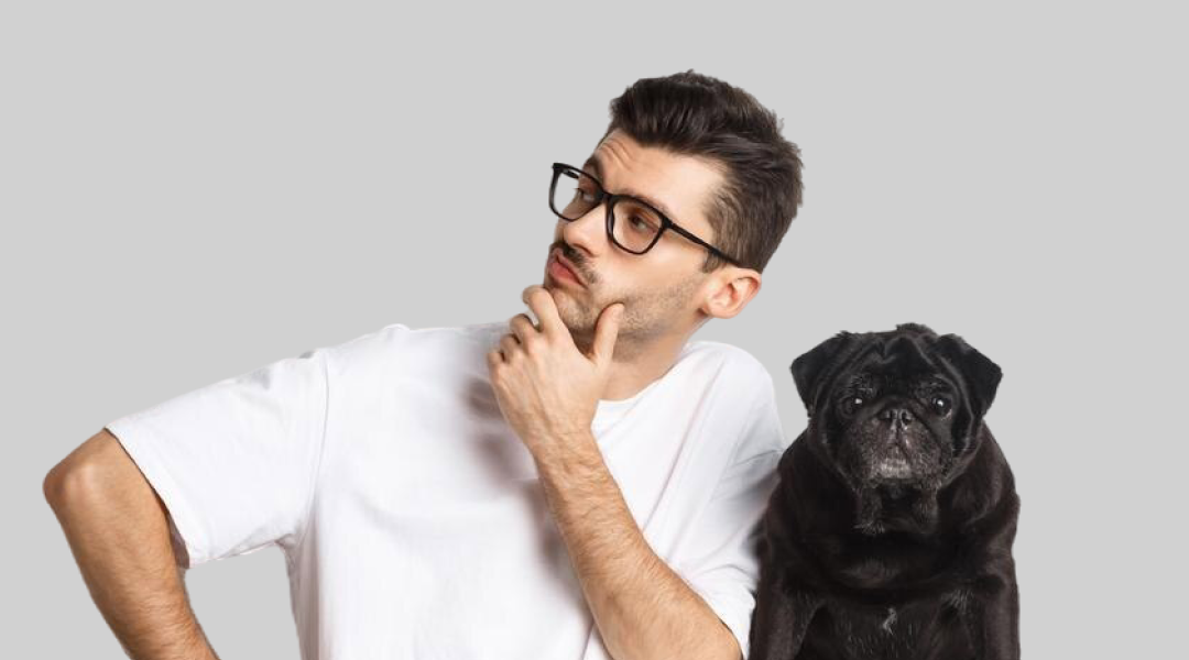 Man posing with his pug dog